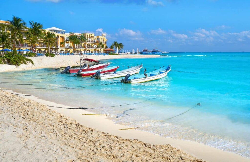 boats in the central beach of playa del carmen